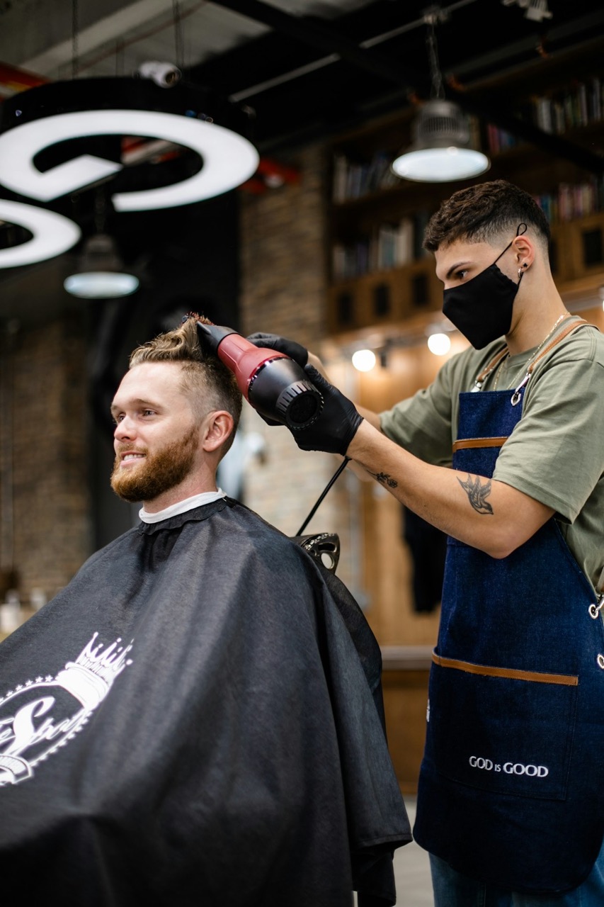Professional hairdresser styling hair